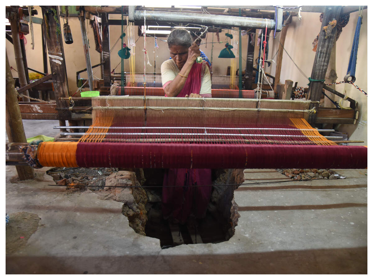 Artisan working at a handloom in India